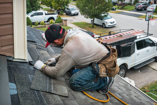 Professional Roofing technician working in Groves, TX
